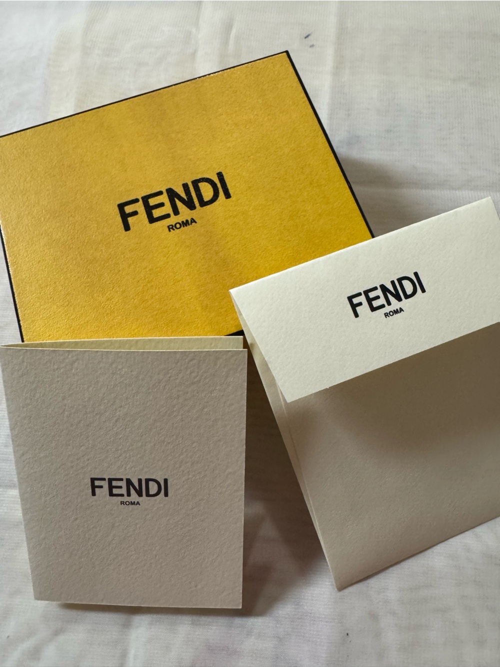 Fendi 💯% Authentic Iconic empty box with coordinating article card and envelope.